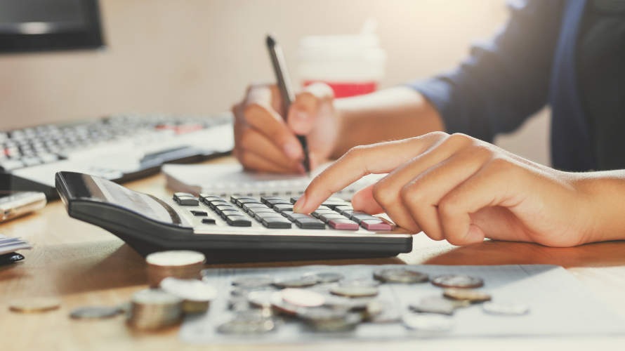 businessman-working-on-desk-office-using-calculator-business-fin